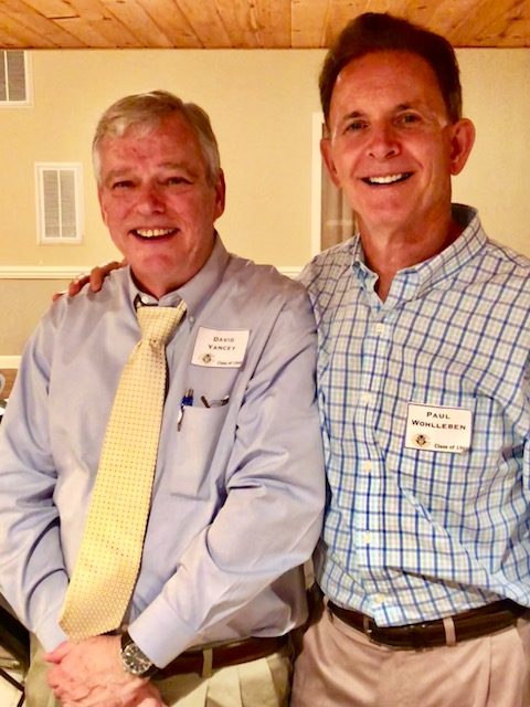 Two brothers in name tags smiling at a class reunion, June 2018