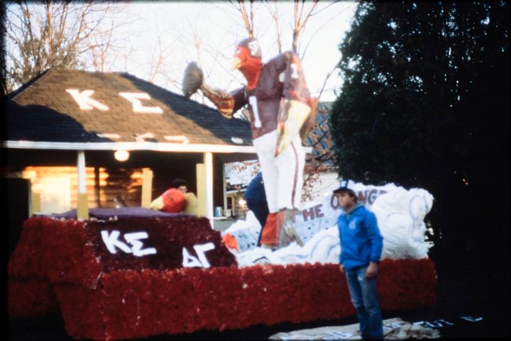 A parade float with Kappa Sigma and Delta Gamma letters, in the snow