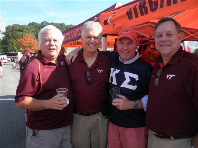 Four brothers in maroon and Kappa Sigma shirts at a Blacksburg tailgate, October 2013