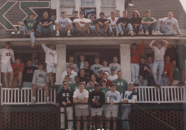 Brothers on the porch and railing of the house in Kappa Sigma letters, 1990