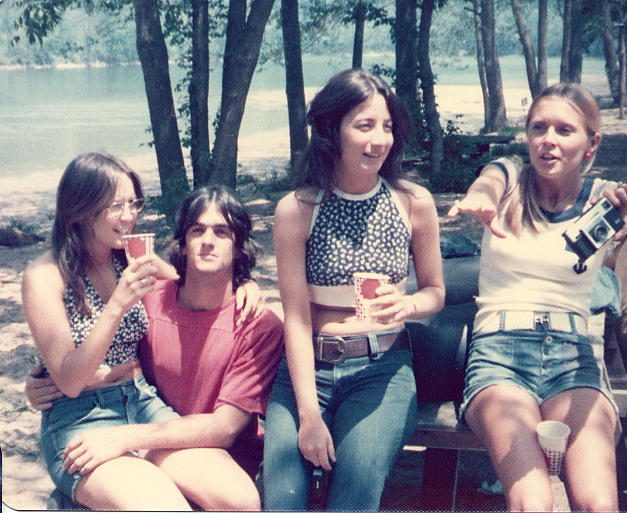 Four women on a bench under the trees
